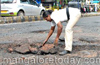After an accident,  good hearted Home Guard fills potholes near Bendorewell Circle